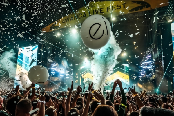 Live concert audience facing a touring LED stage screen