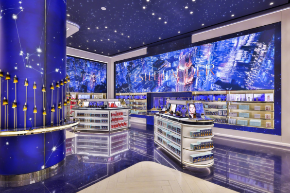 Retail store interior with a large indoor LED video wall displaying brand content